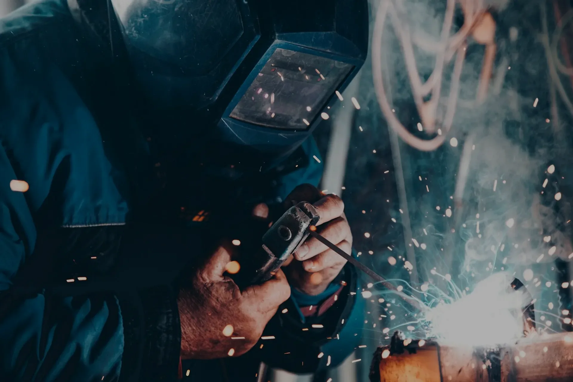 Welder at work, sparks flying