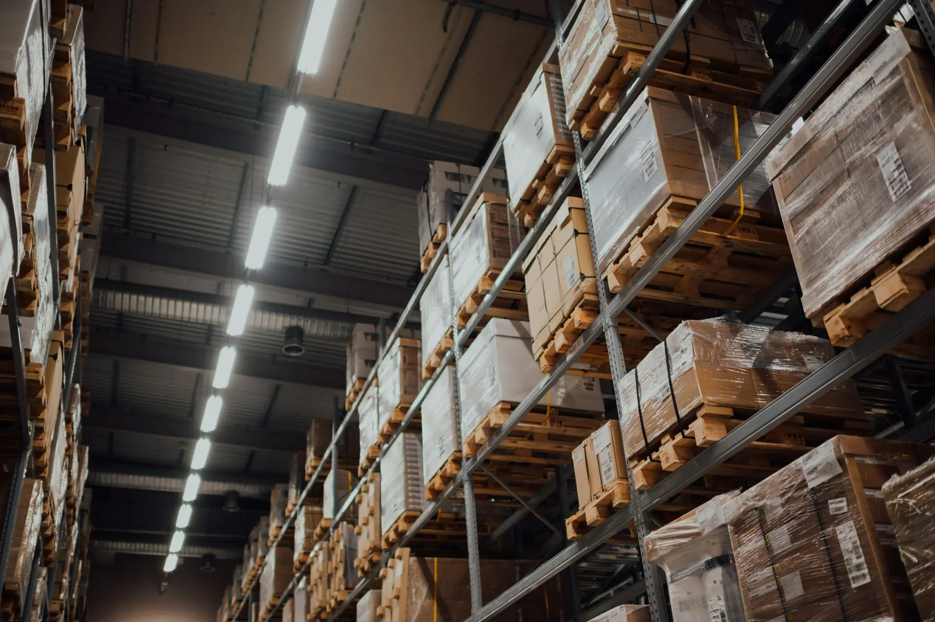 Warehouse aisle stacked with pallets